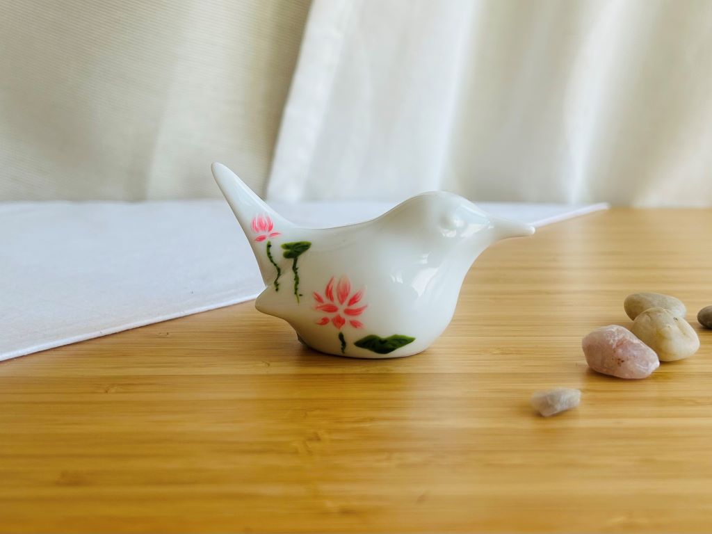 porcelain bird with various Japanese garden motifs