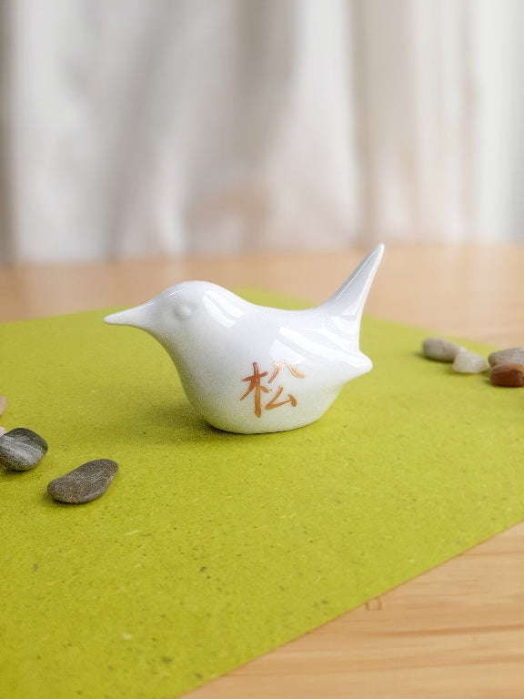 porcelain bird with various Japanese garden motifs