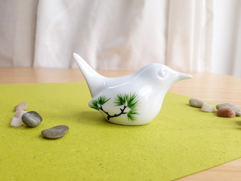 porcelain bird with various Japanese garden motifs