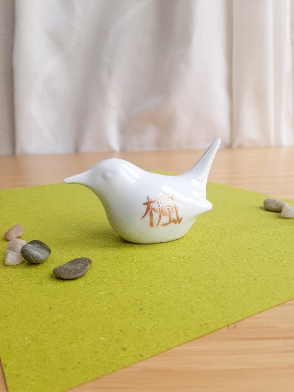 porcelain bird with various Japanese garden motifs