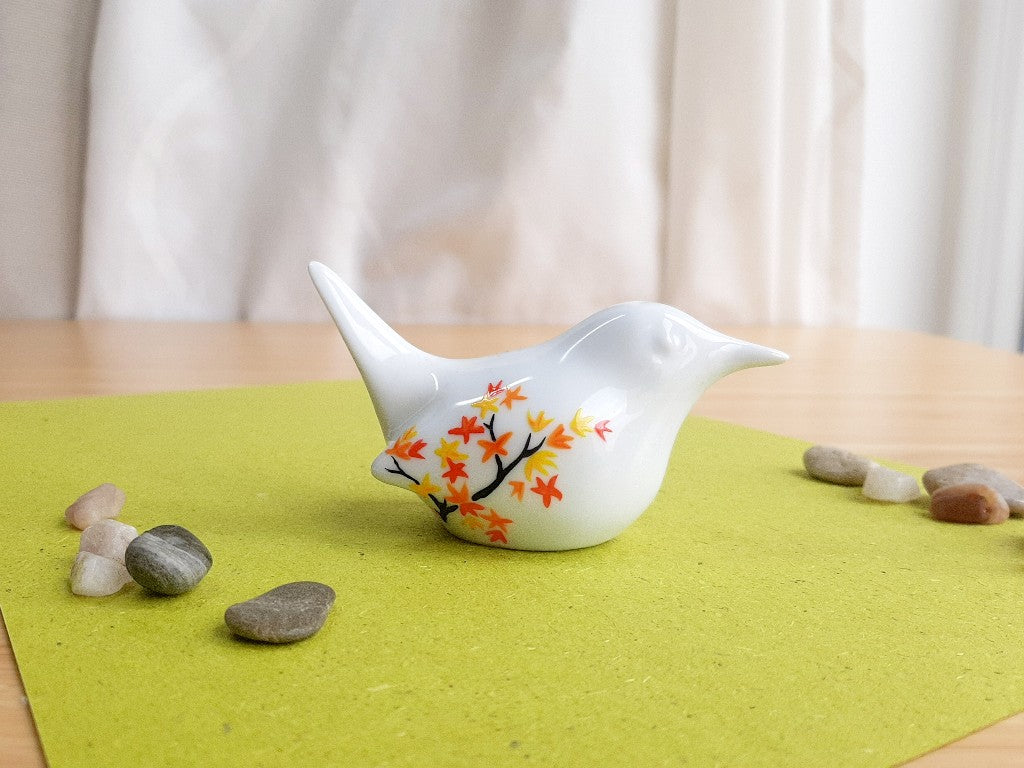 porcelain bird with various Japanese garden motifs
