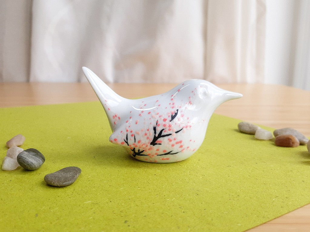 porcelain bird with various Japanese garden motifs