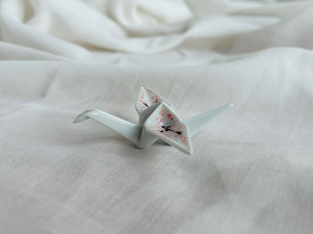 porcelain origami crane "Morning under the Sakura" standing