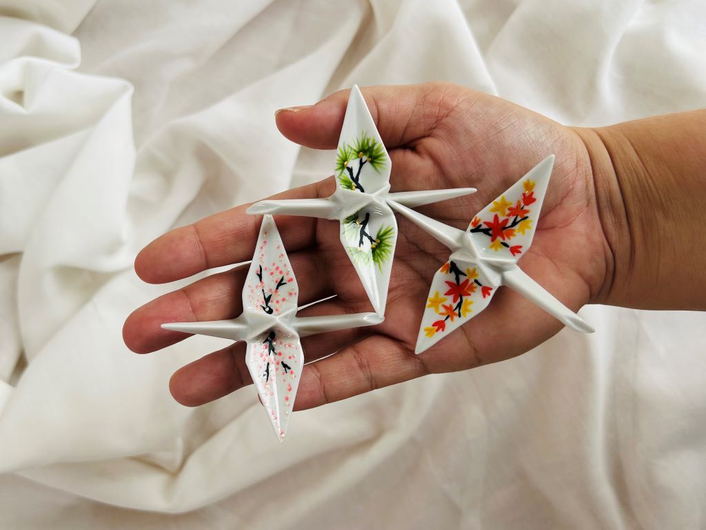 porcelain origami crane "Morning under the Sakura" standing